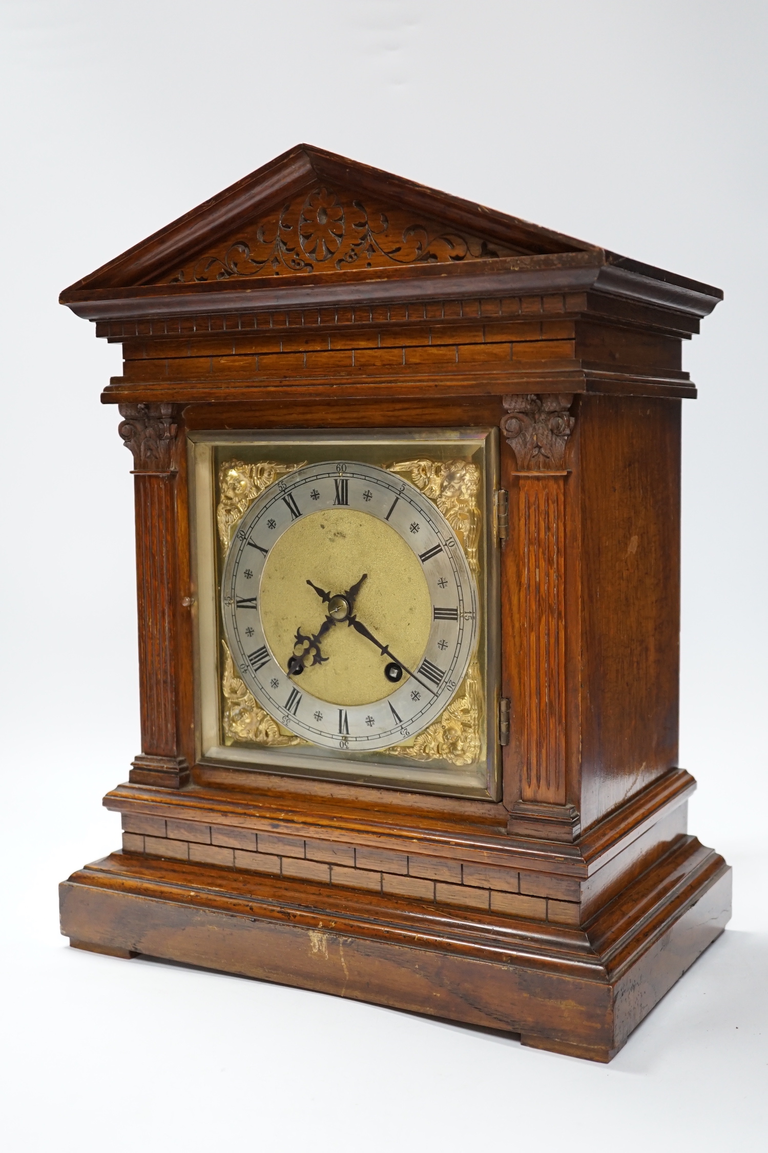 Victorian oak mantel clock, brass dial and mask spandrels; Winterhalder & Hoftmier two train movement, quarter striking in an architectural case, 39cm. (Provenance Phillips Chester 7/05/93), 40cm high